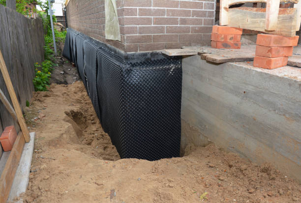 Happy homeowners after waterproofing job in Hoytville